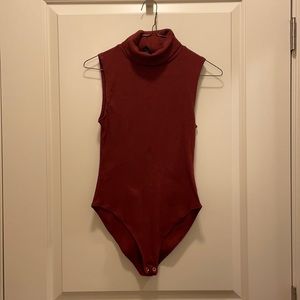 Red turtleneck bodysuit